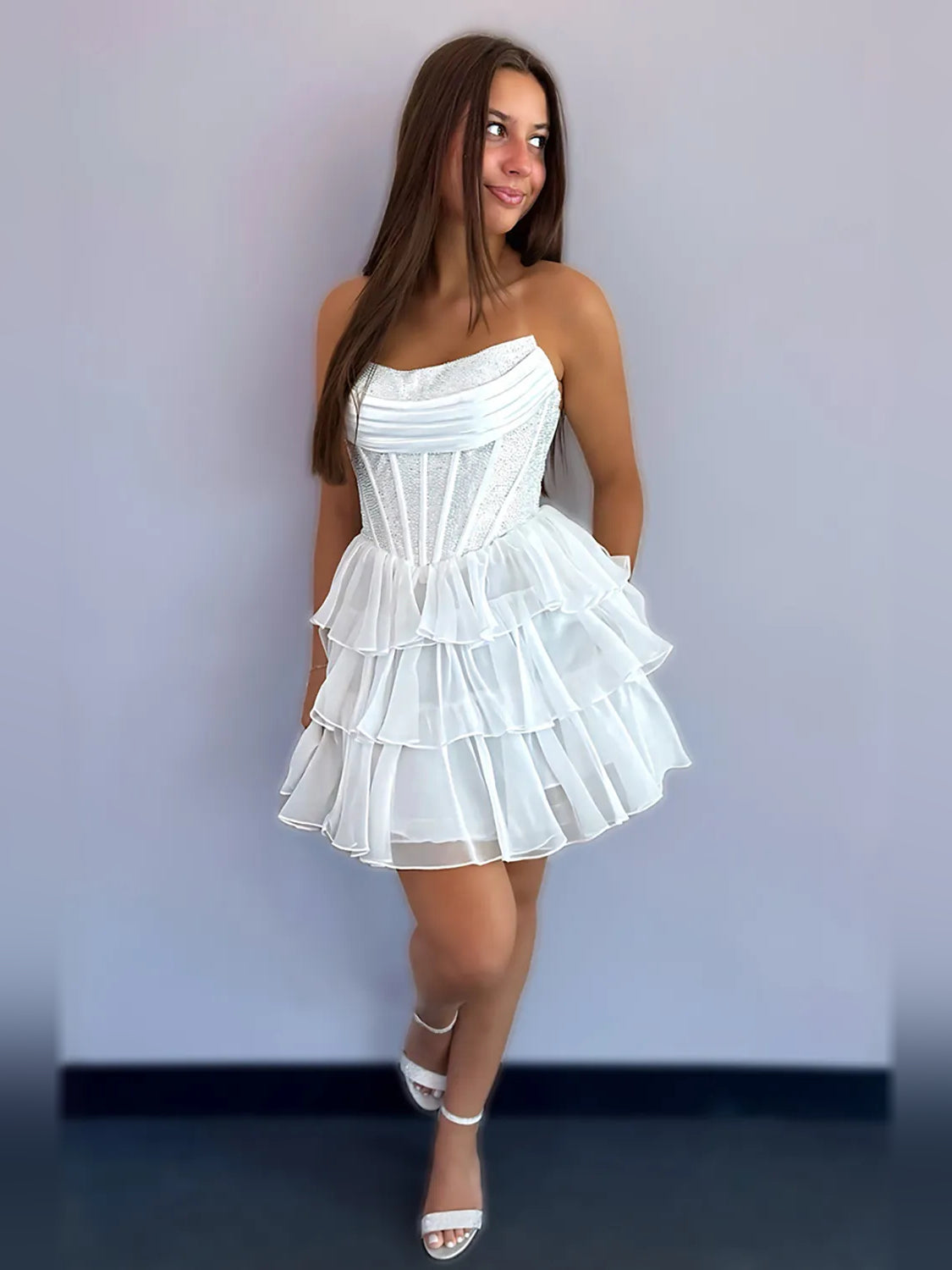 White strapless chiffon homecoming dress with ruched bodice and tiered ruffle skirt