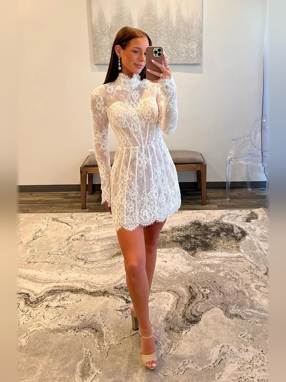 White lace corset mini dress featuring high neck, long sleeves, and A-line silhouette