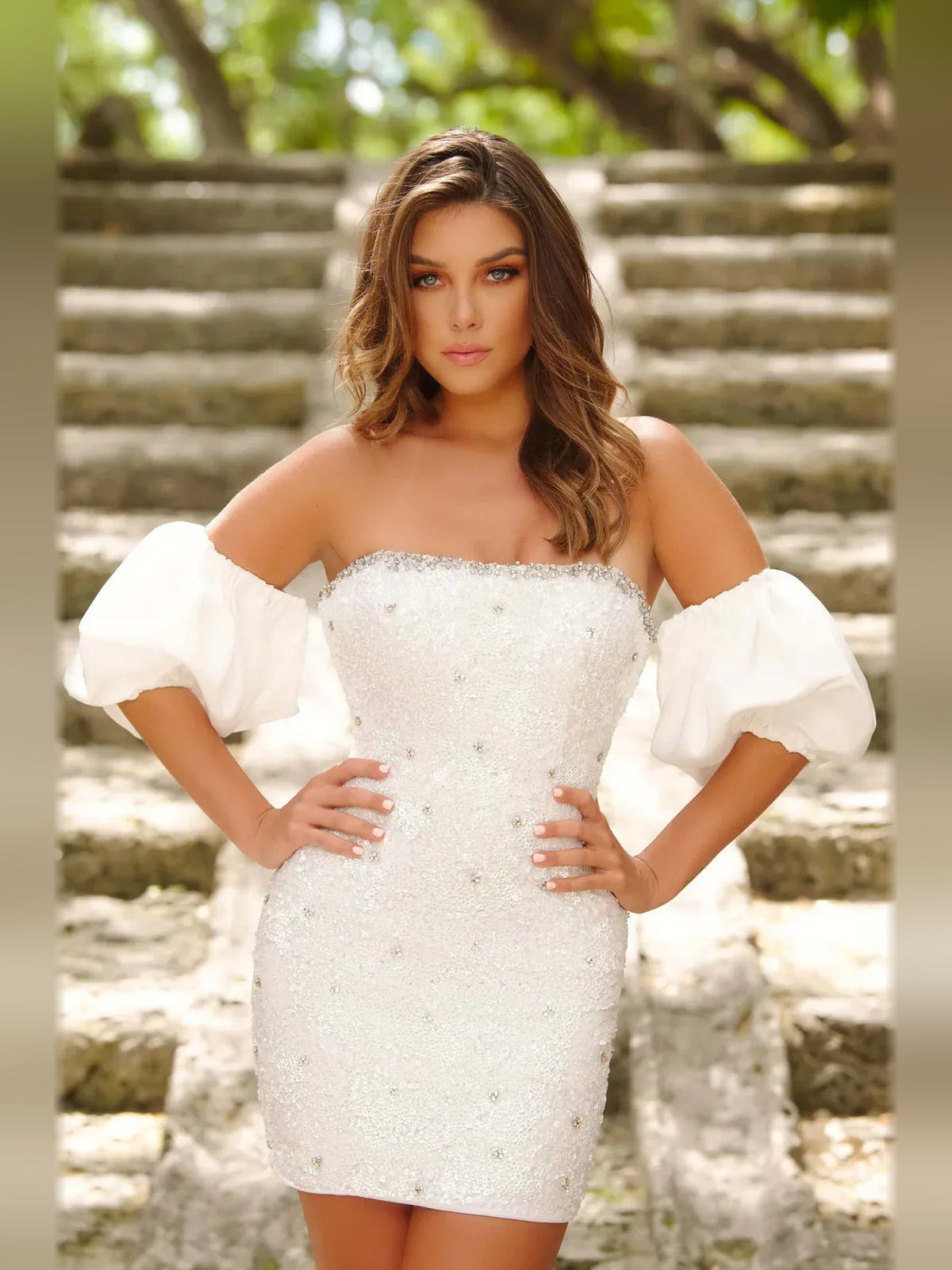 White strapless sequin mini dress with off-shoulder puff sleeves and fitted waist