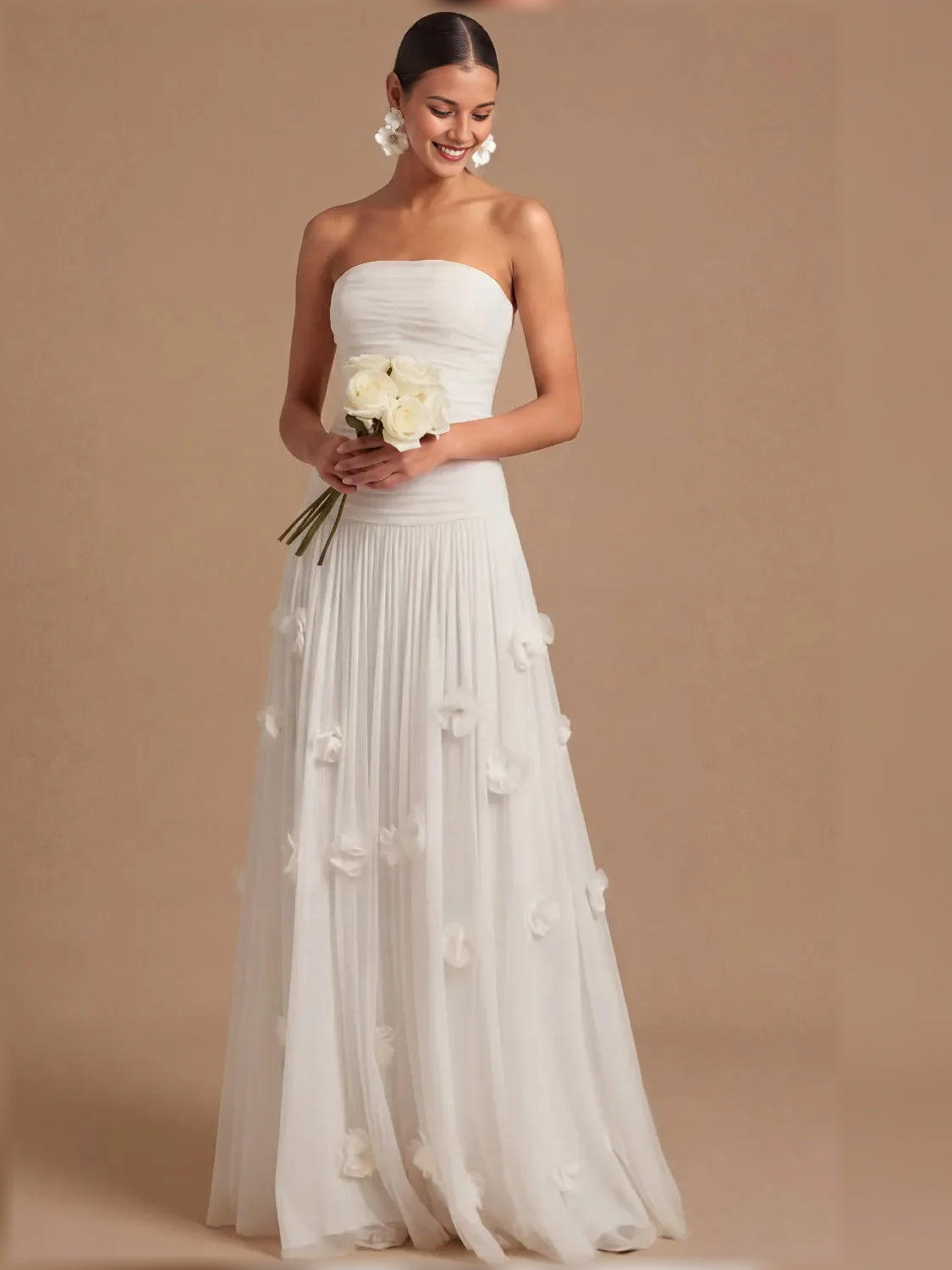 White strapless formal dress with ruched bodice and 3D floral appliques, full length
