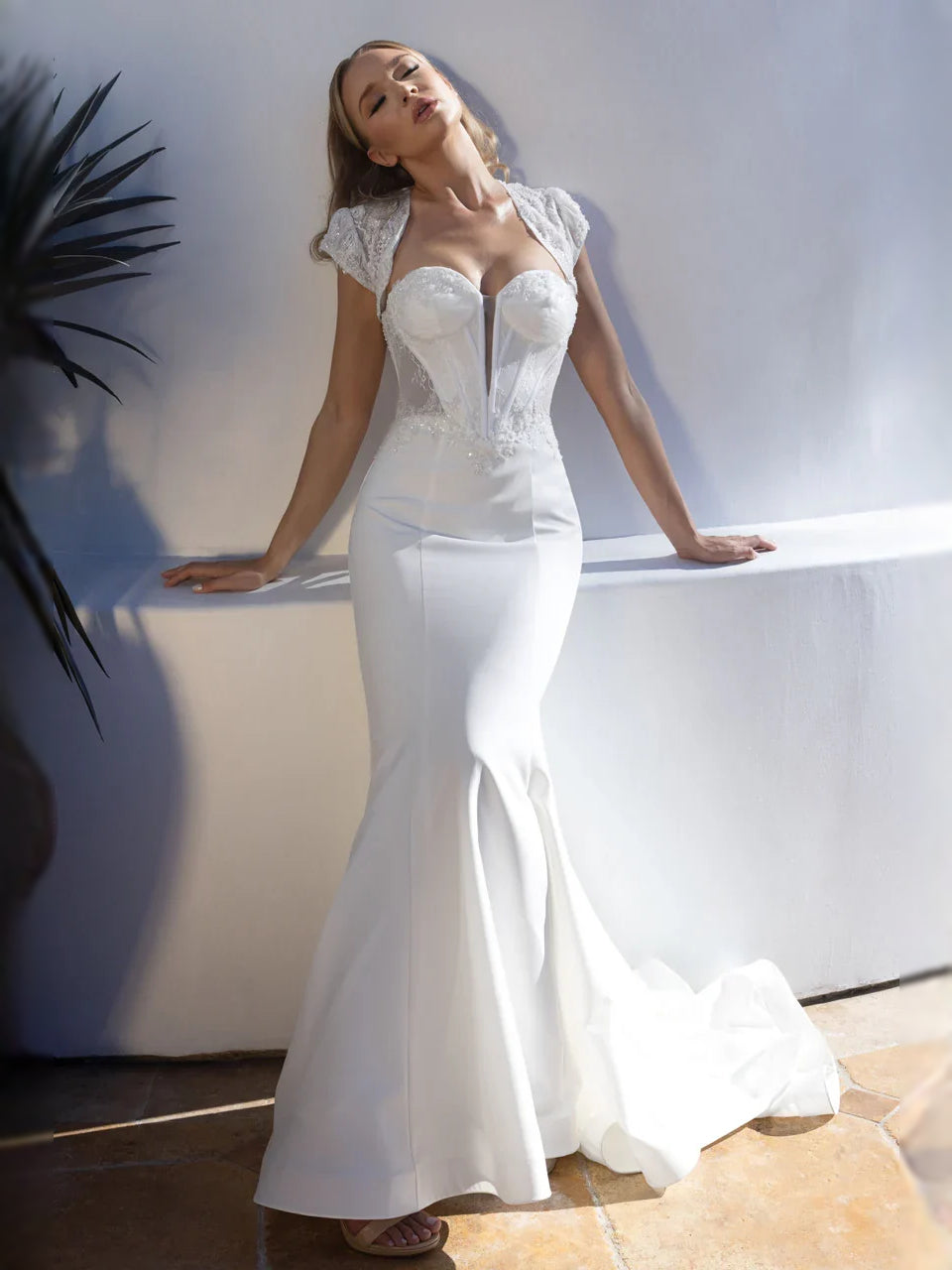 White sweetheart corset mermaid wedding dress with beaded lace bodice, full-length