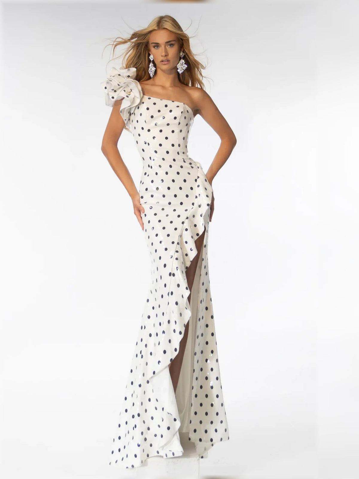 White polka dot one-shoulder gown with ruffled shoulder and asymmetrical drape