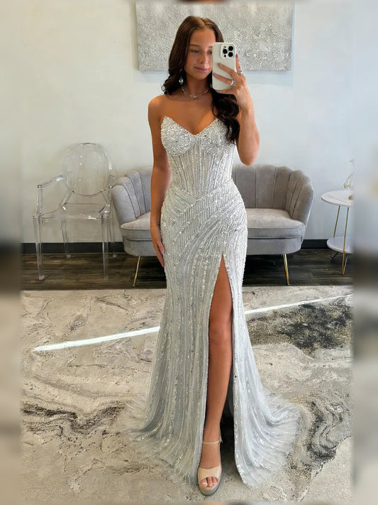 Silver sweetheart corset slit formal dress with beaded shimmer, floor-length.