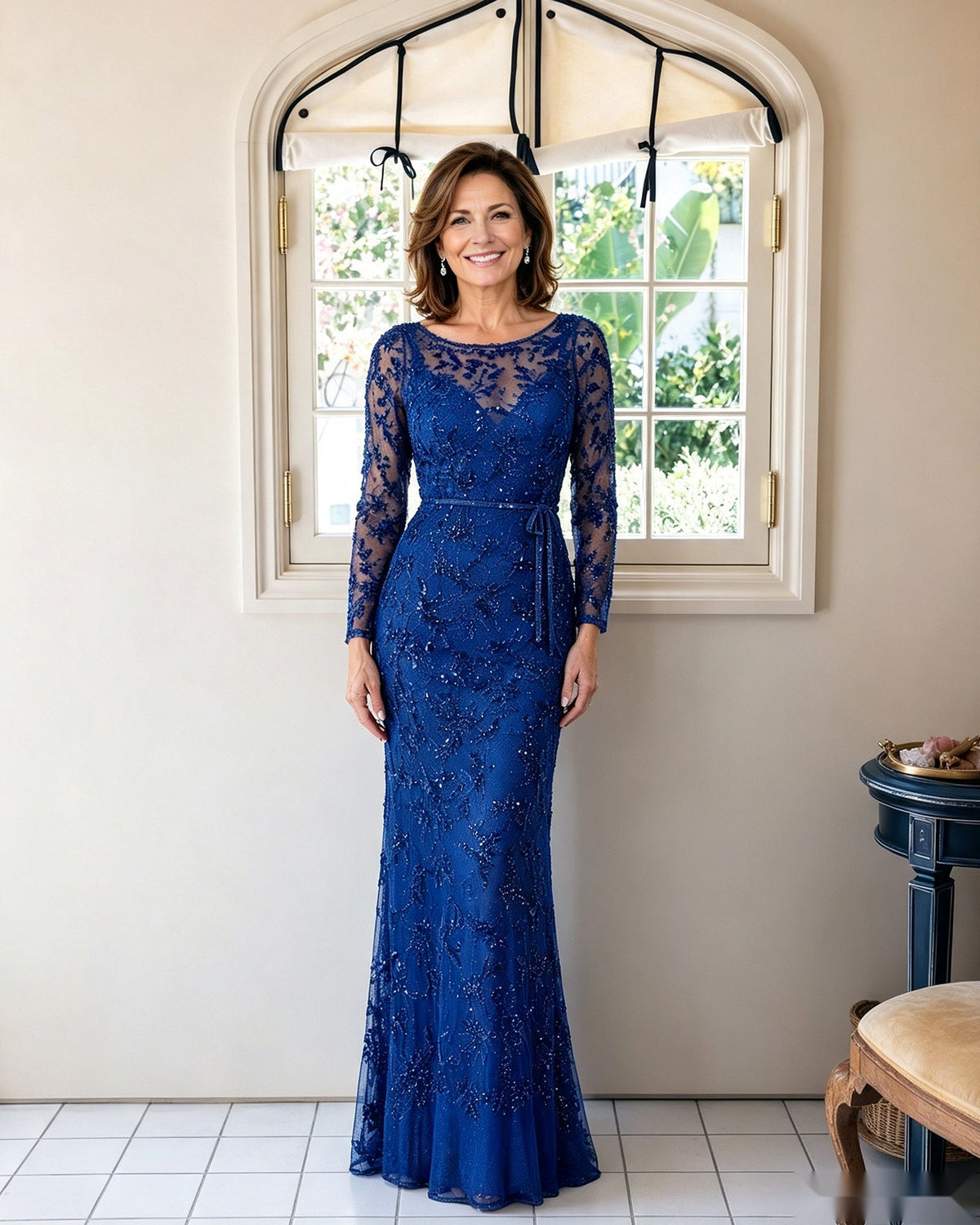 Illusion lace long-sleeve sheath dress in royal blue, fitted lace pattern with illusion neckline.