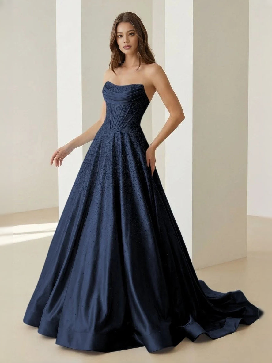 Royal blue strapless corset ballgown with gathered waist and full floor-length skirt