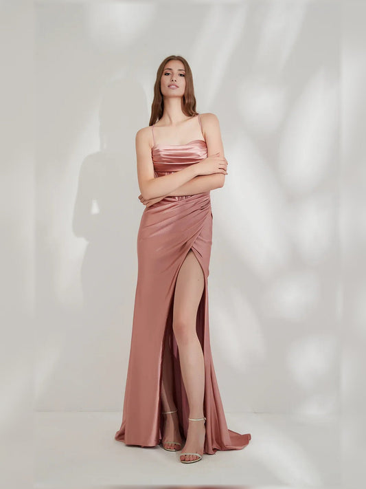 Rose gold cowl-neck corset formal dress with front slit and draped skirt, floor length
