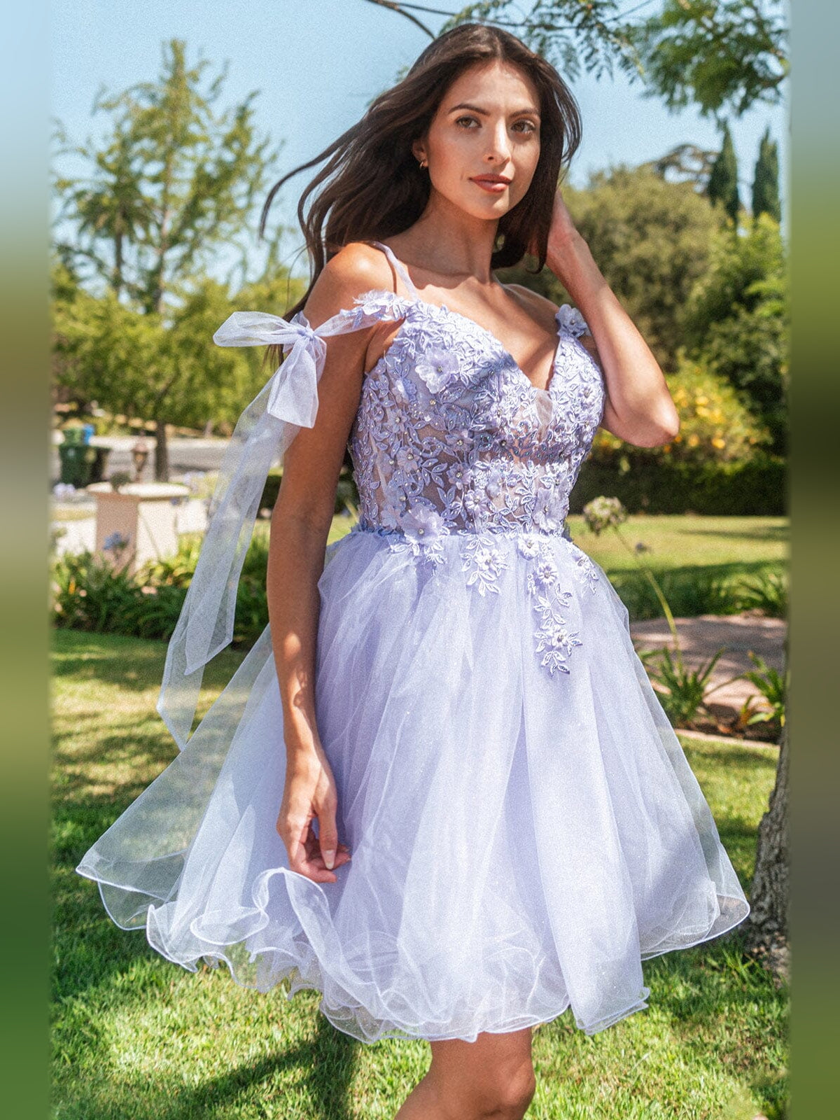 Short tulle A-line homecoming dress with floral appliqué, V neck, and shoulder bow