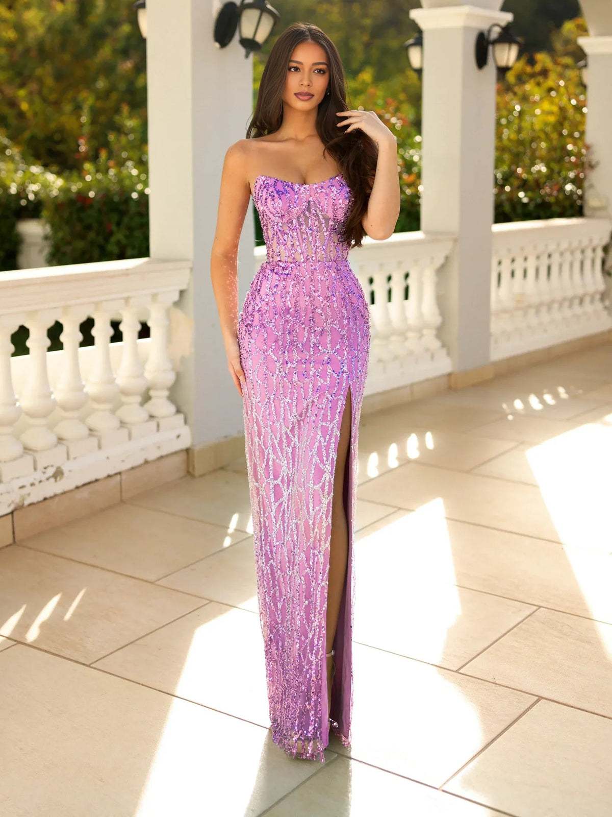 Lilac strapless corset gown with fitted bust, gathered waist, and floor-length slit
