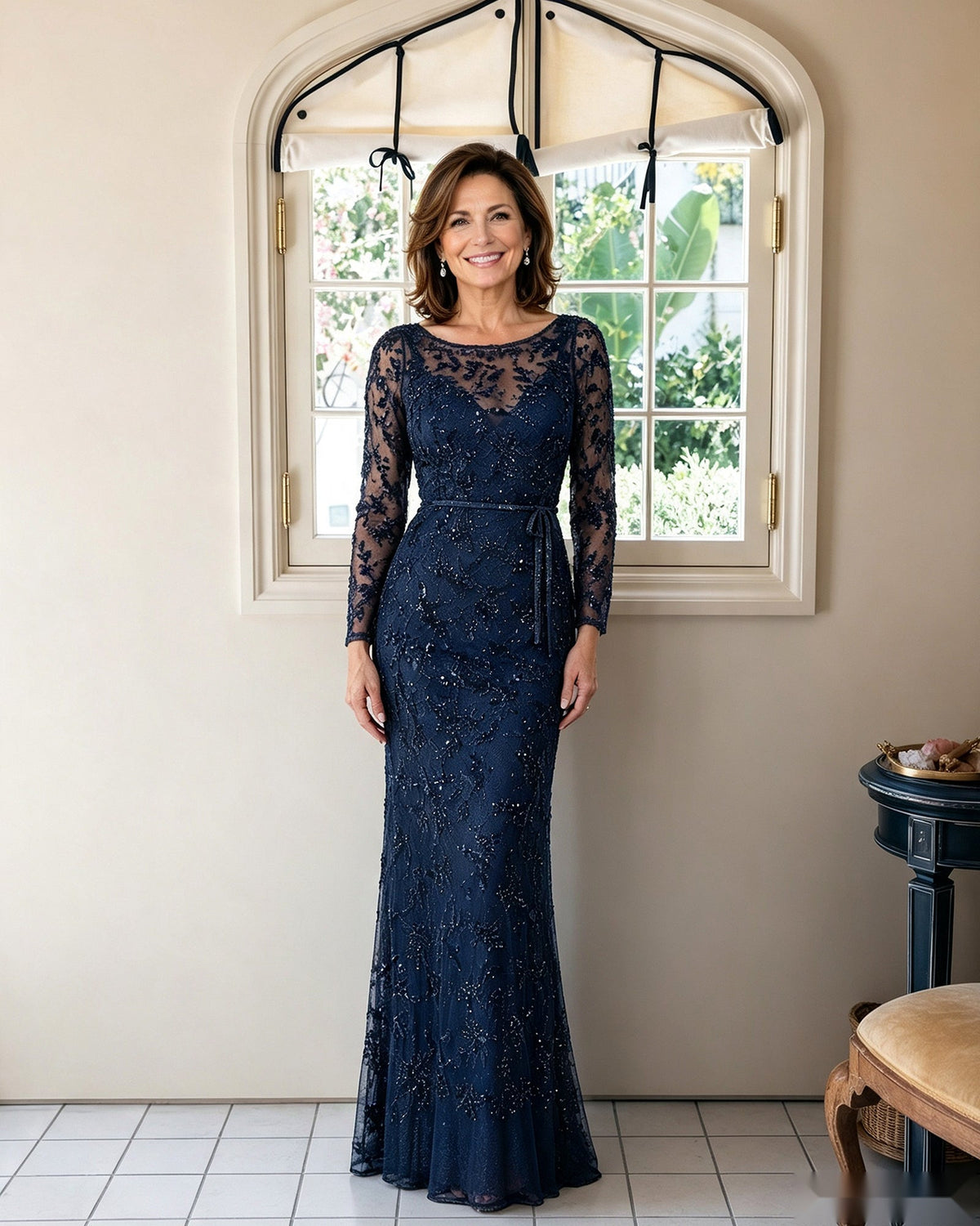 Illusion lace long-sleeve sheath dress in navy, lace allover design with tailored waist seam.