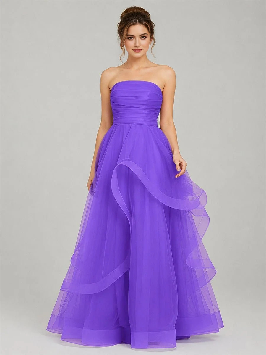 Purple strapless tulle ball gown with ruched corset bodice and layered ruffle skirt