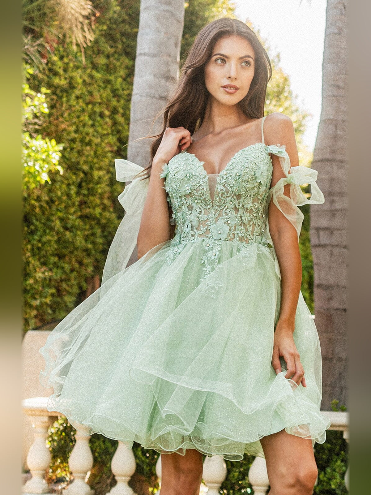 Dusty sage tulle A-line homecoming dress with floral applique bodice and bow sleeves