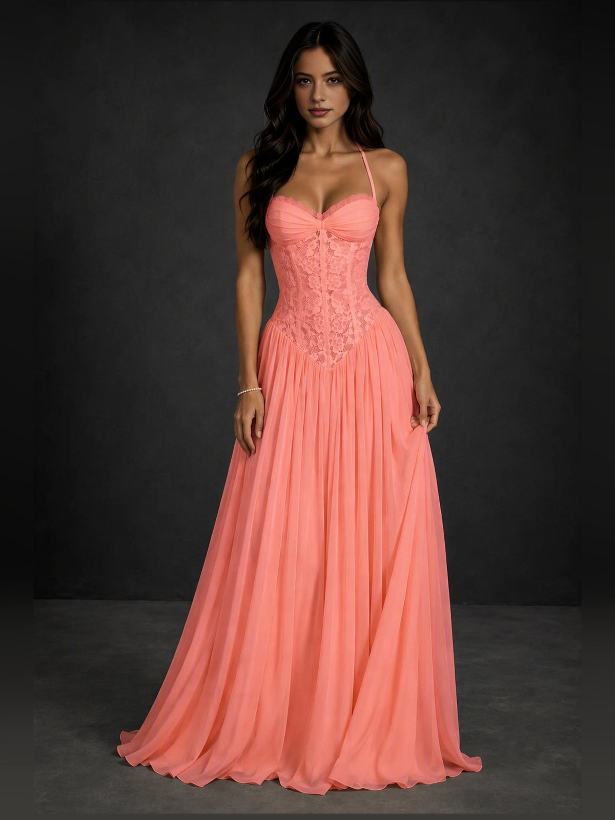 Coral A-line prom dress with sweetheart neckline, spaghetti straps, ruched pleated skirt.