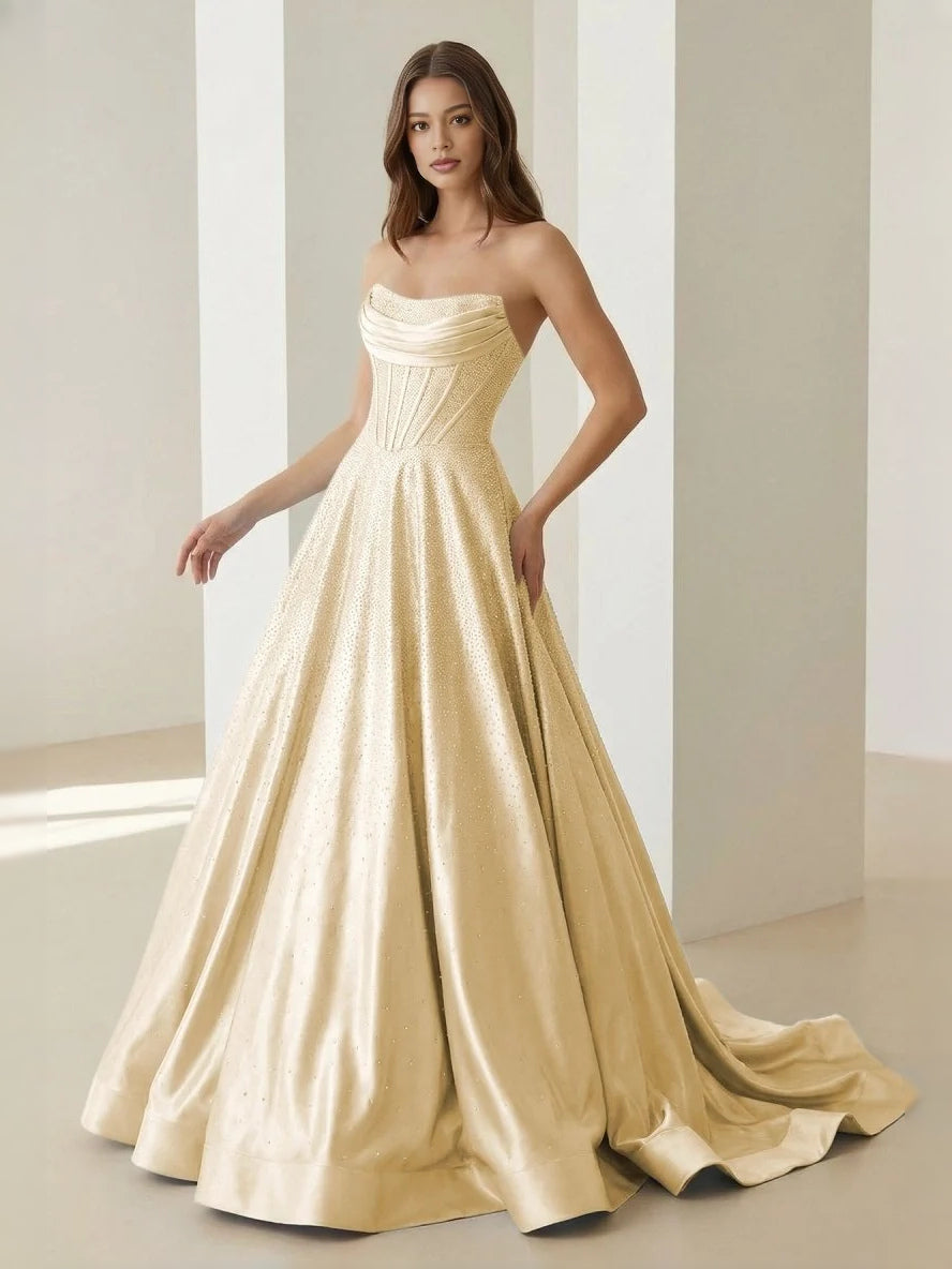 Ivory strapless draped corset ball gown with full floor-length skirt