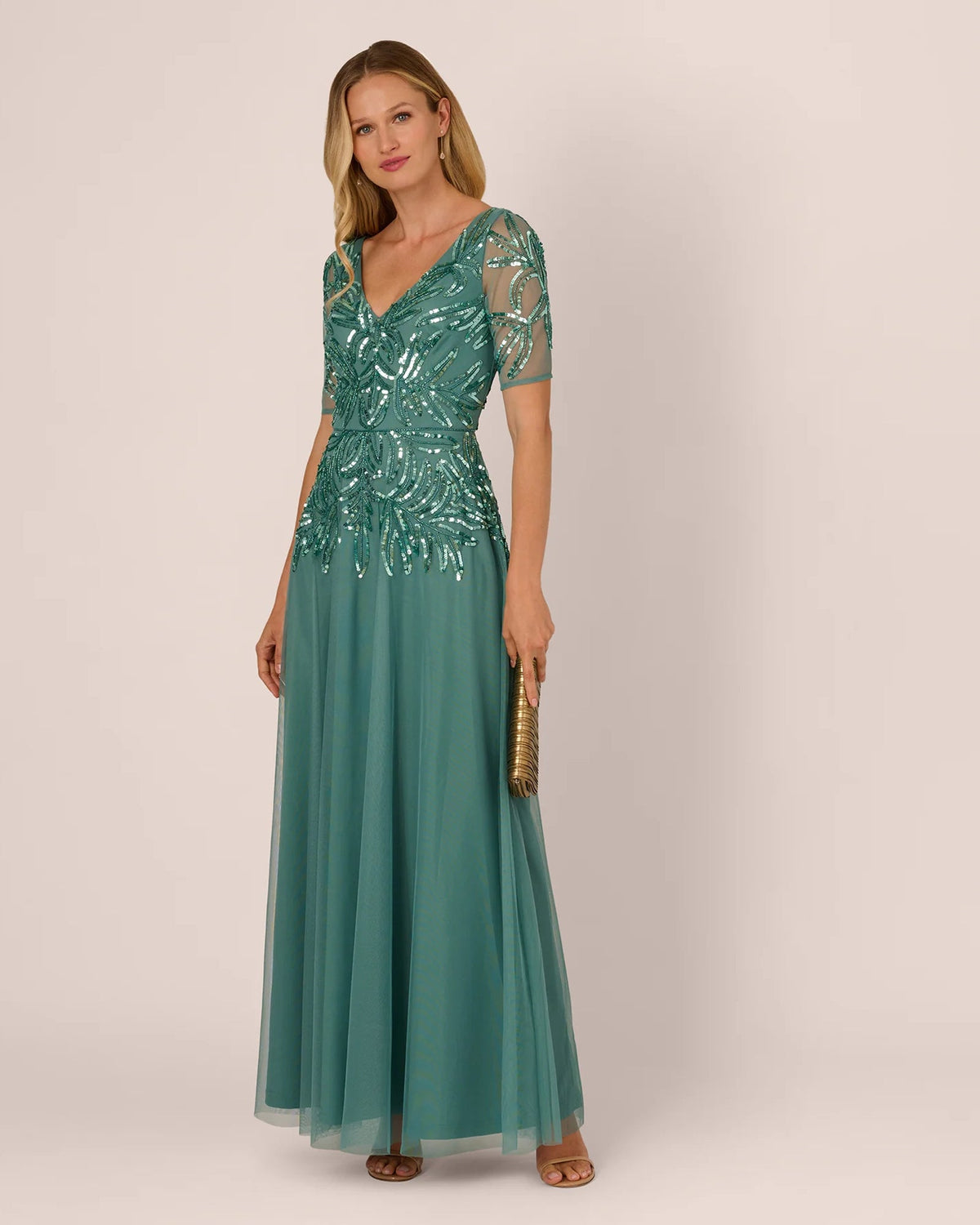 Teal A-line maxi dress with draped sequin bodice and flowing tulle skirt