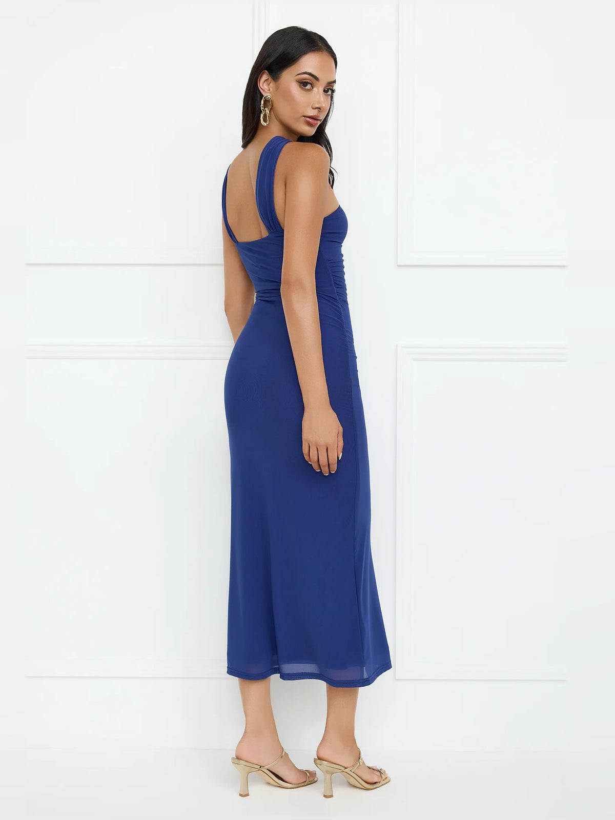 Blue one-shoulder mesh midi dress, side view with ruched bodice and long skirt