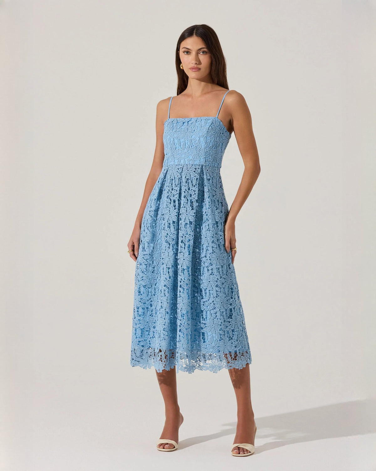 Blue sleeveless A-line midi dress with spaghetti straps and lace-textured skirt