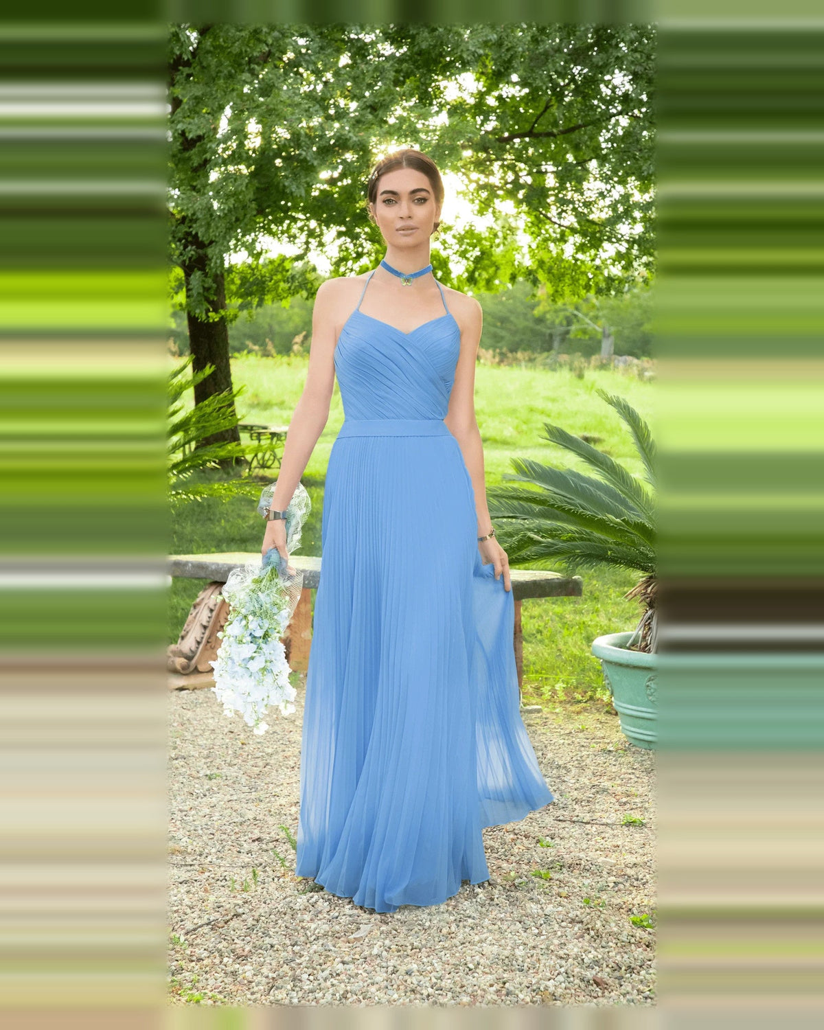 Light blue pleated V-neck A-line floor-length prom dress with flowing skirt