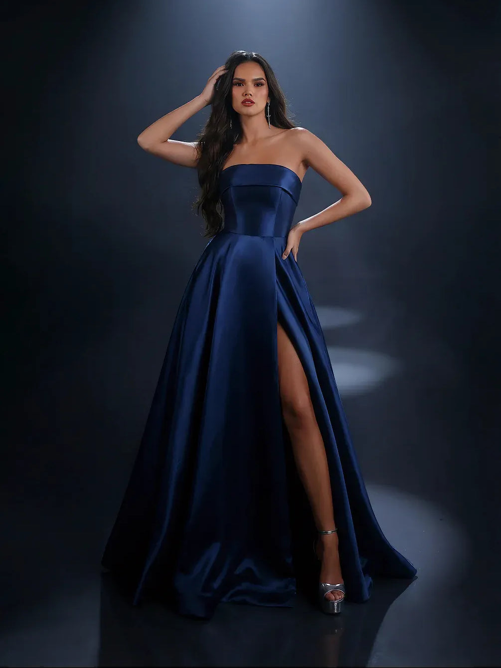 Dark blue strapless satin gown with high slit, fitted bodice and full skirt