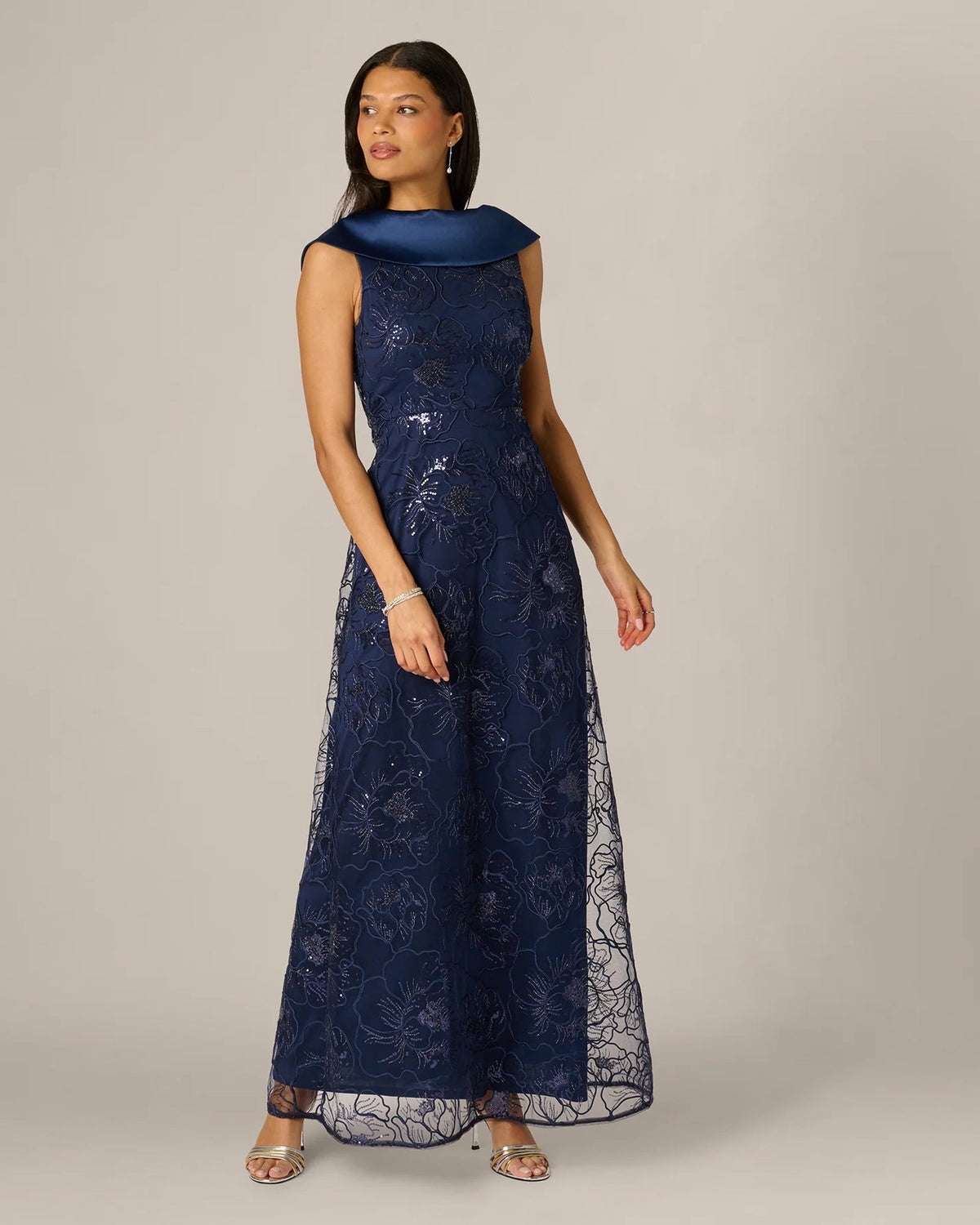 Midnight blue sleeveless floral lace maxi dress with high draped collar and A-line skirt
