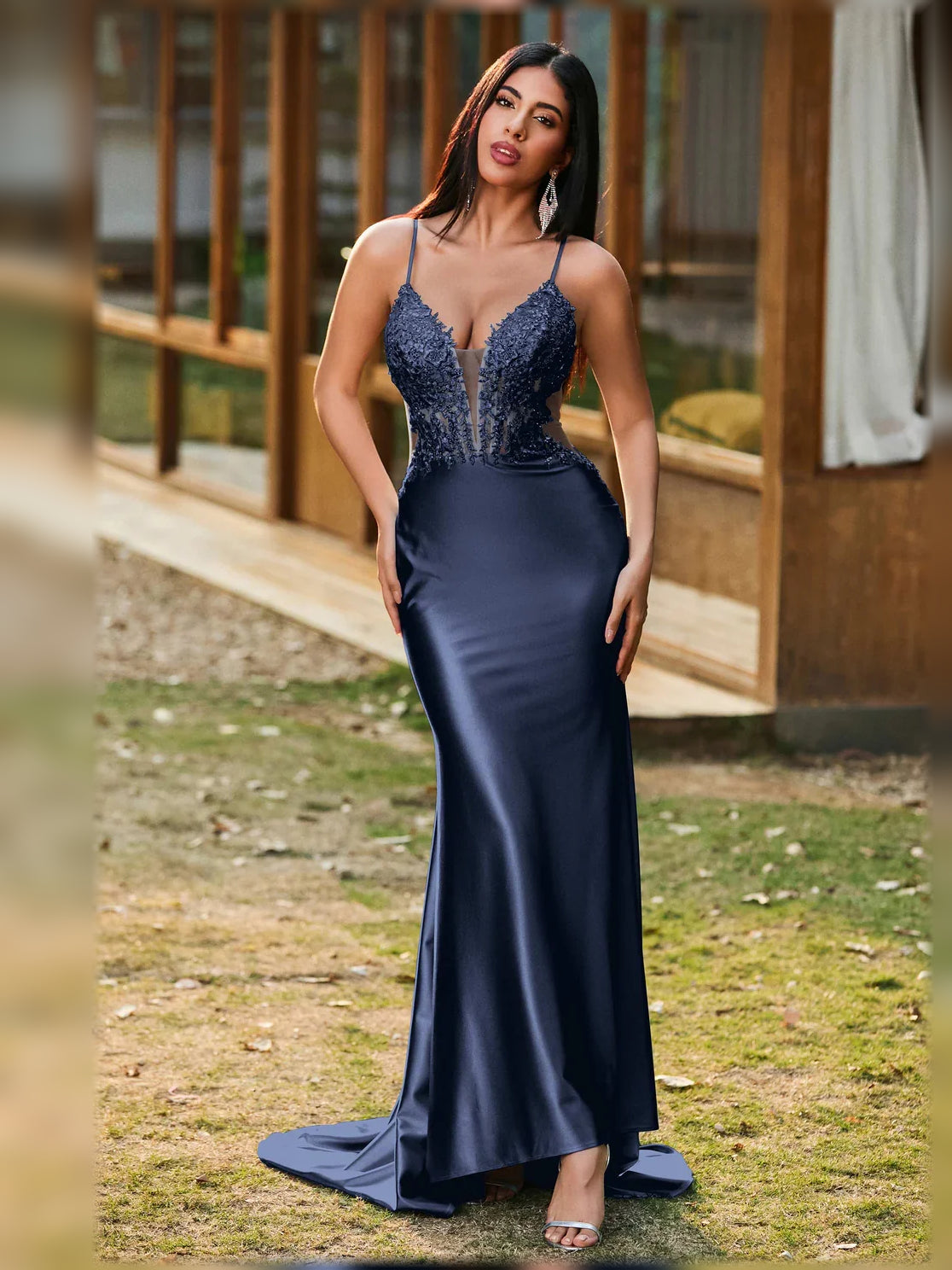 Navy blue V-neck corset-style formal dress with lace detail and open back