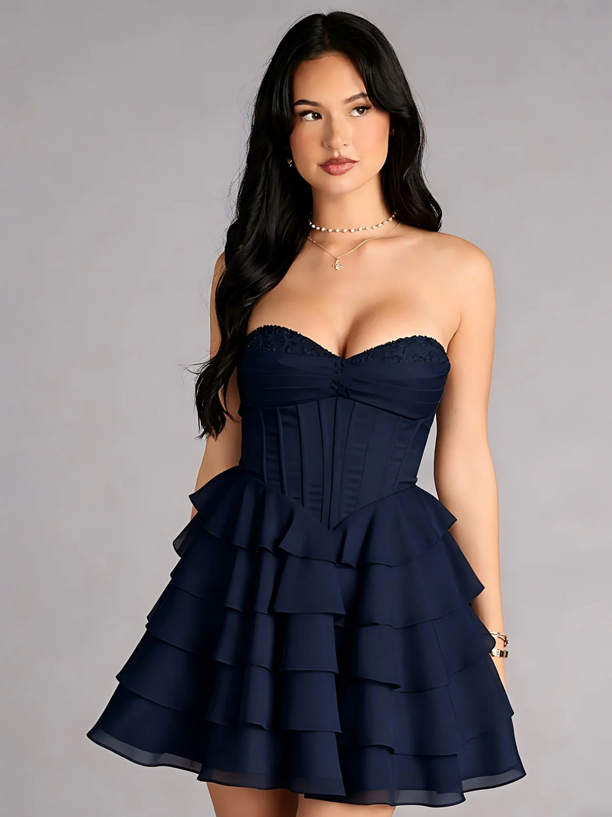 Navy blue strapless corset mini dress with tiered ruffles and A-line skirt