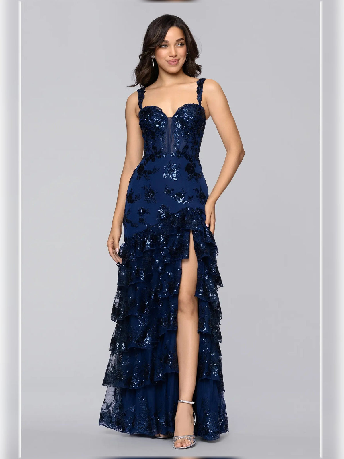 Navy blue floral print sweetheart formal dress with spaghetti straps and floor-length ruffle skirt