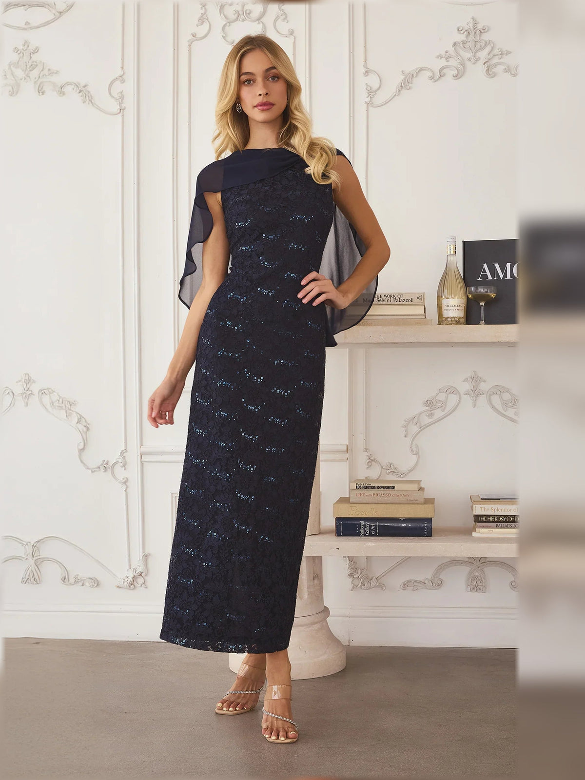 Navy lace midi sheath dress with sheer cape sleeves and side slit