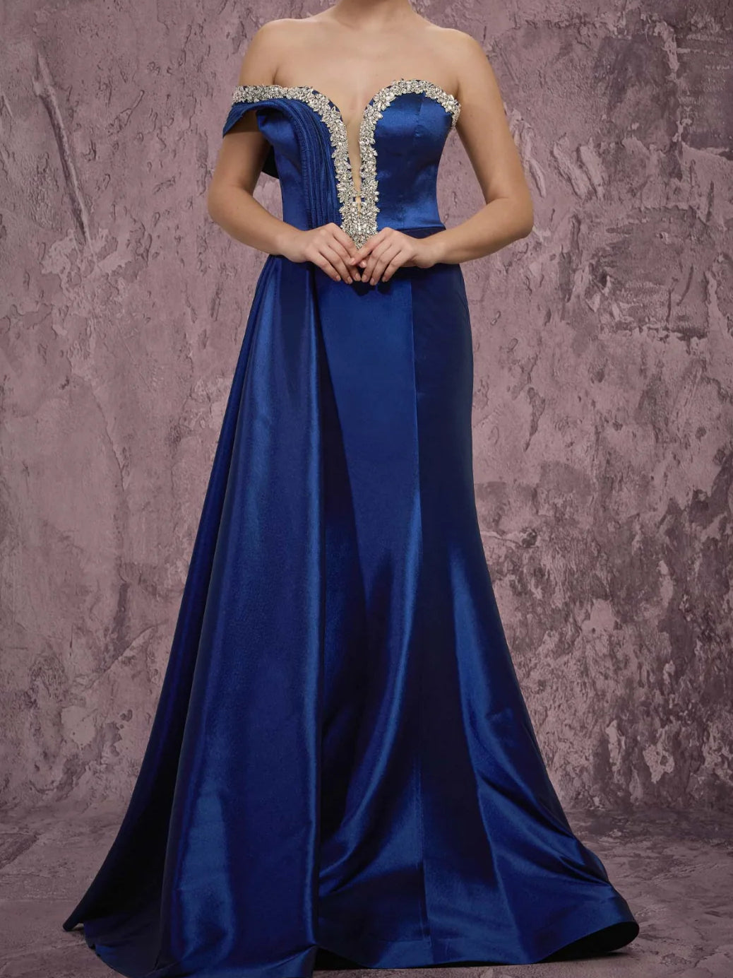 Navy off-shoulder satin formal gown with ornate beaded neckline and long skirt
