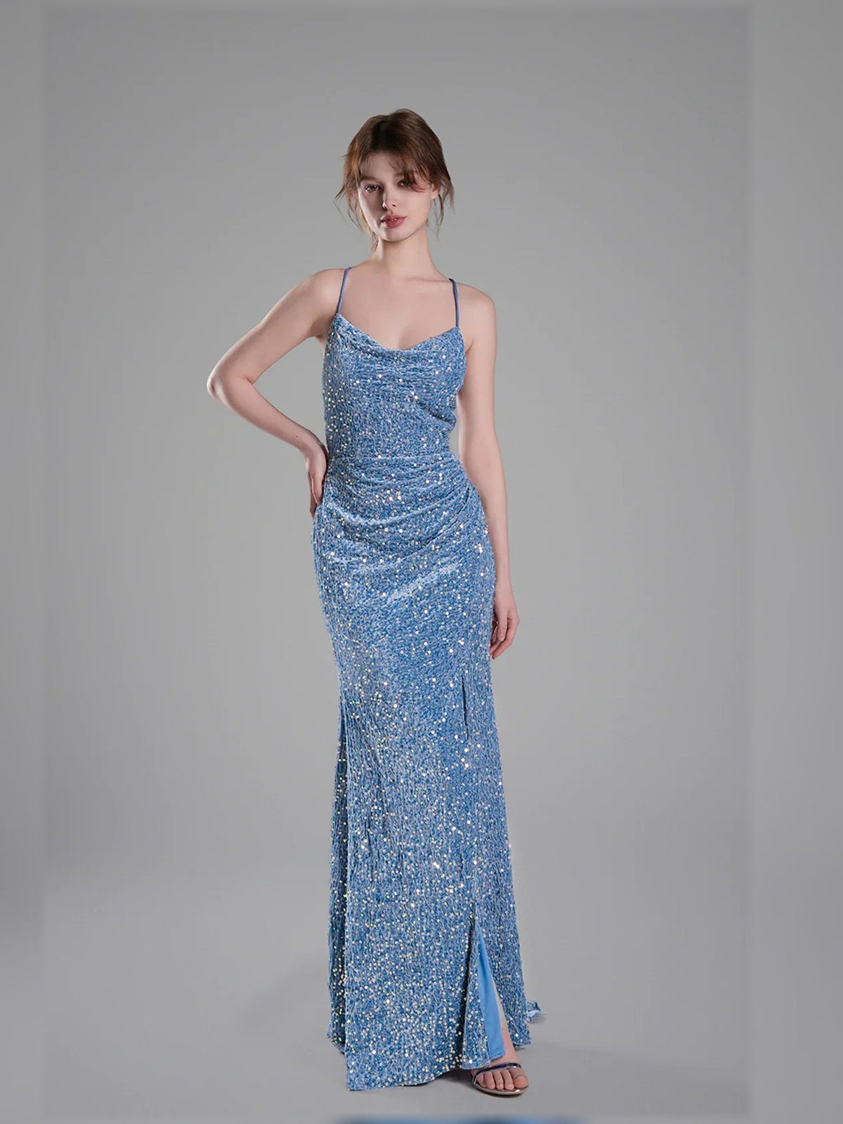 Blue floor-length sequin formal dress with spaghetti straps and front slit