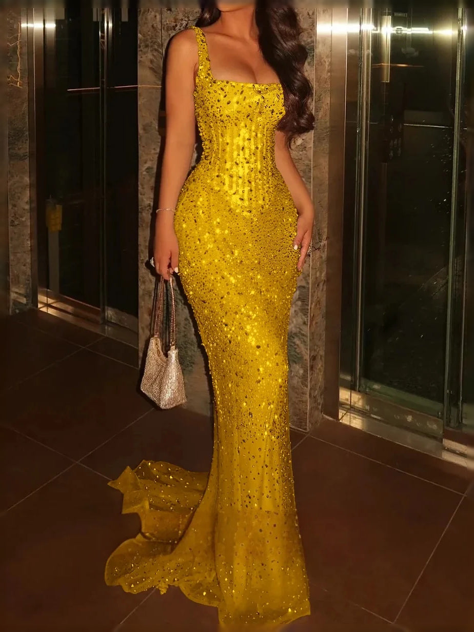 Gold/yellow sequined corset-style prom dress with square neckline and side slit, floor-length