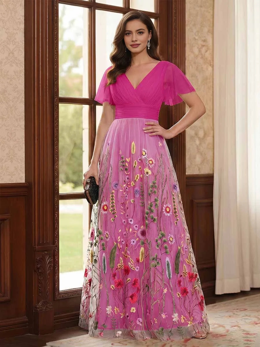 Fuchsia V-neck A-line tulle dress with ruched waist, flutter sleeves, floral embroidery.