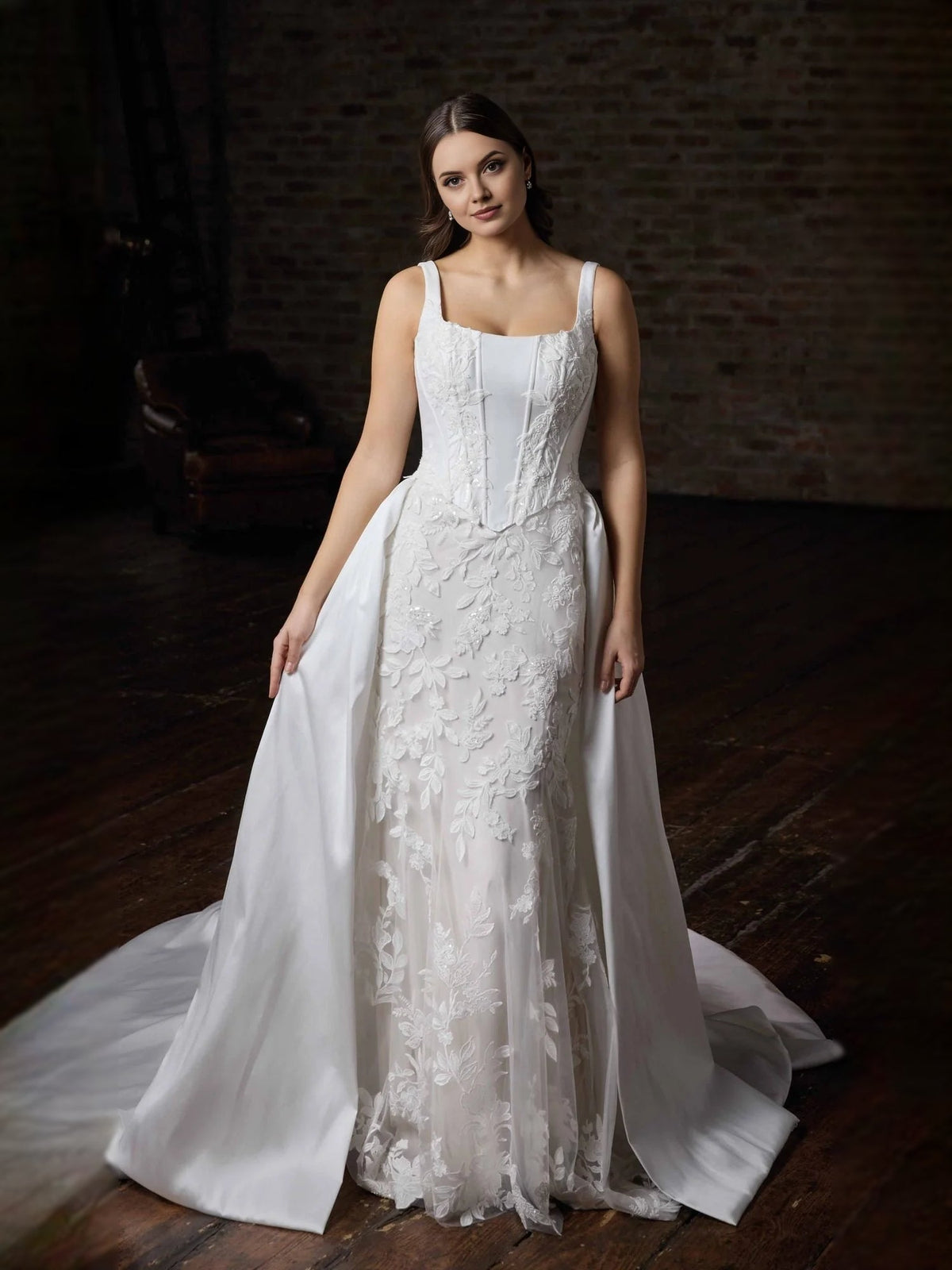 Ivory corset-style mermaid wedding dress with square neckline and 3D floral lace hem