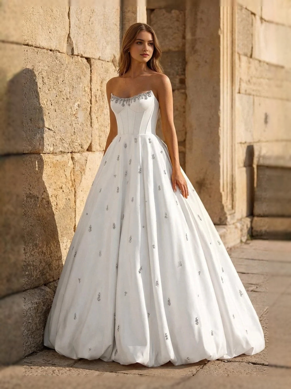 Ivory sweetheart corset ball gown with tulle skirt and allover gold sparkle dots