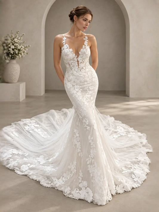 Ivory sleeveless V-neck wedding dress with floral lace bodice and layered A-line tulle skirt