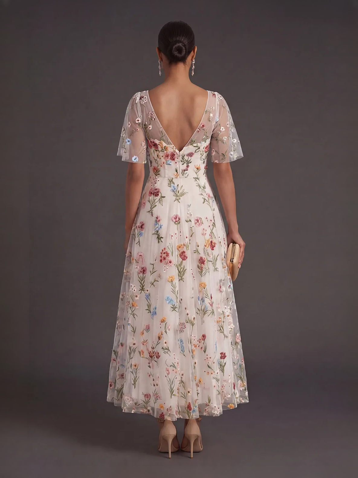 Ivory floral tulle prom dress back view, V-back with embroidered mesh sleeves