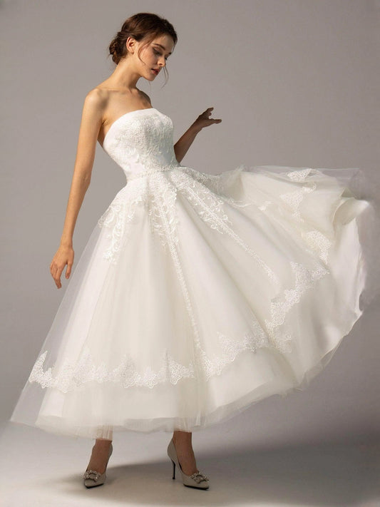Ivory strapless A-line short wedding dress with lace bodice and voluminous tulle skirt