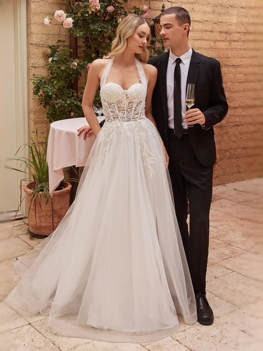 White tulle A-line wedding dress with sweetheart corset bodice and floral lace overlay