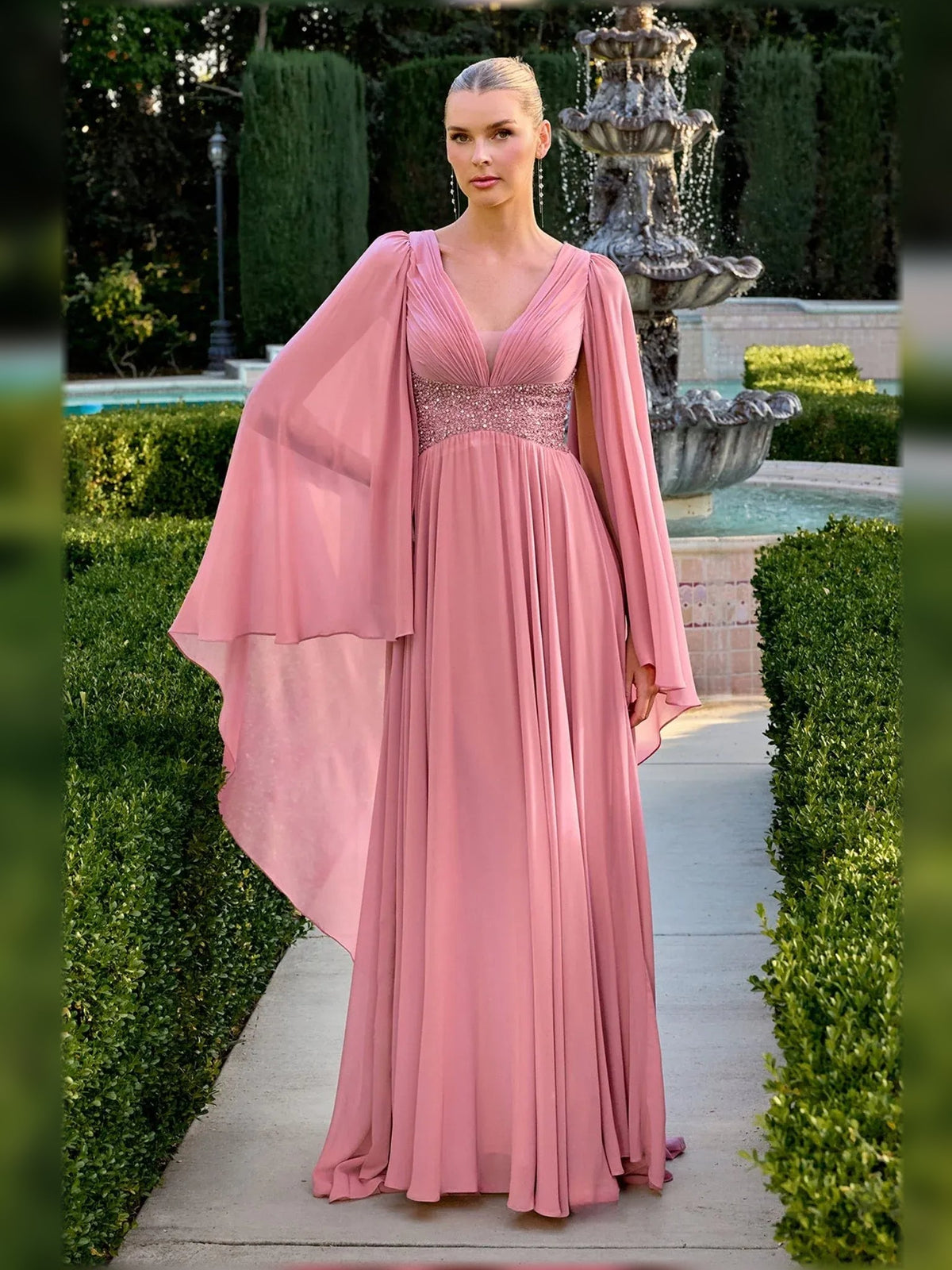 Dusty pink chiffon V-neck A-line floor dress with pleated skirt and flowing cape sleeves