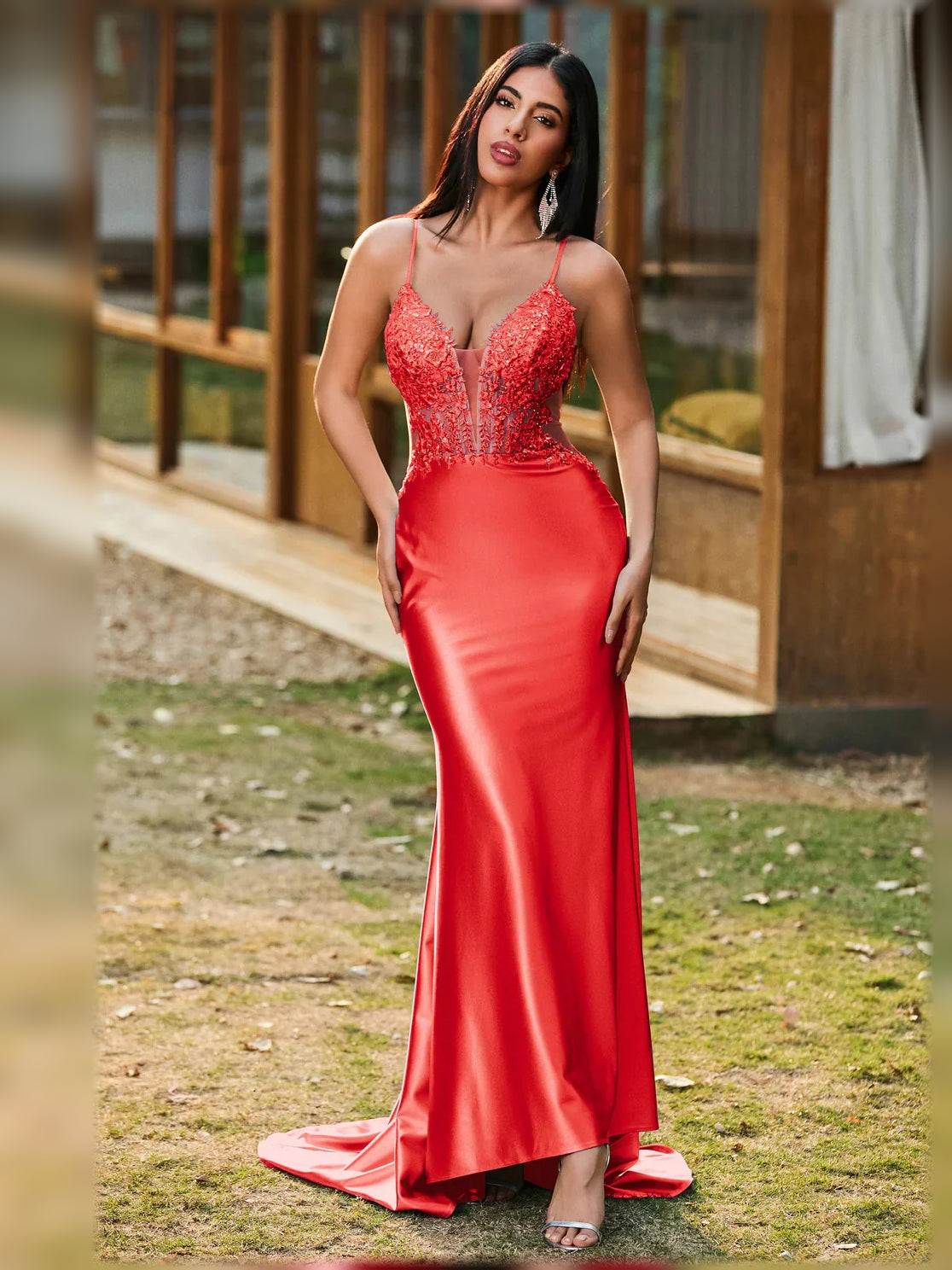 Red V-neck corset-style formal dress with lace detail and open back