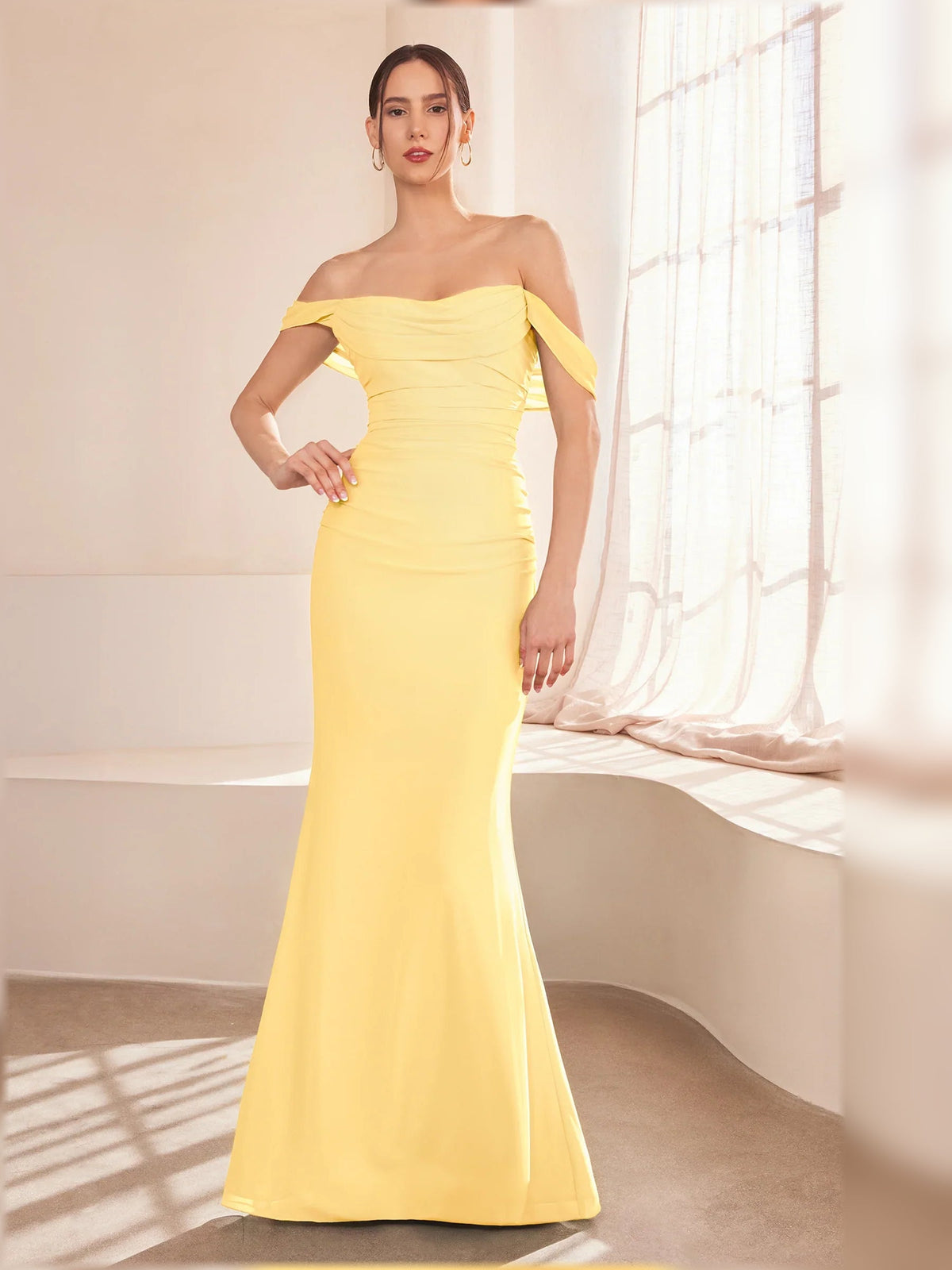 Pale yellow off-the-shoulder ruched floor-length formal gown with fitted mermaid silhouette