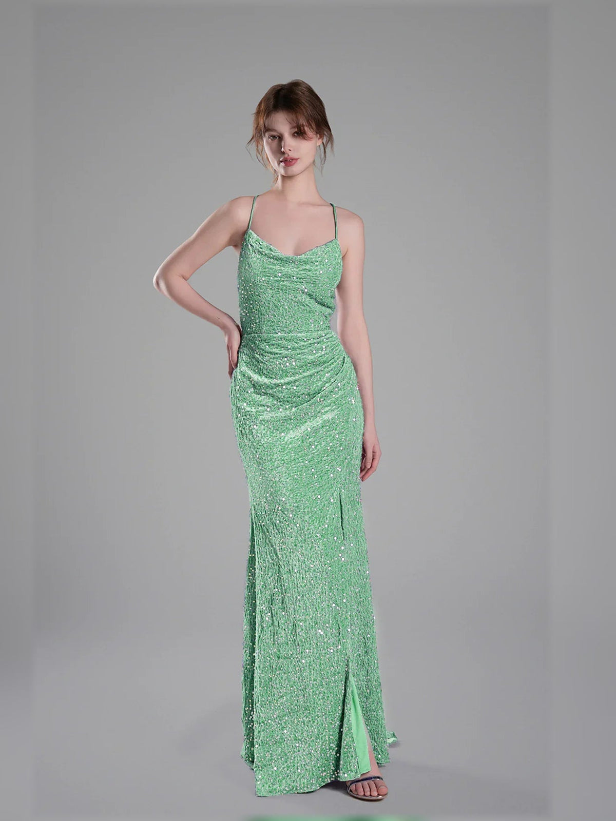 Mint green floor-length sequin formal dress with spaghetti straps and front slit