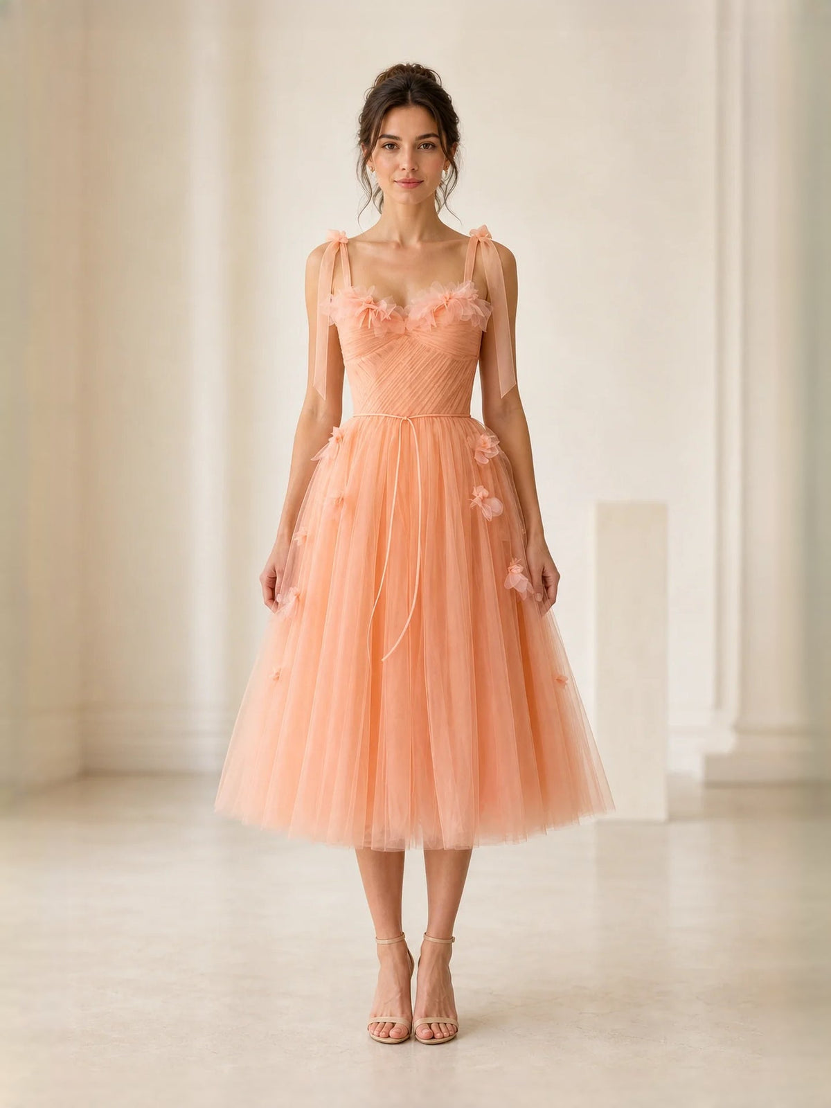 Orange tulle A-line midi prom dress with floral trim, corset bodice, and bow straps