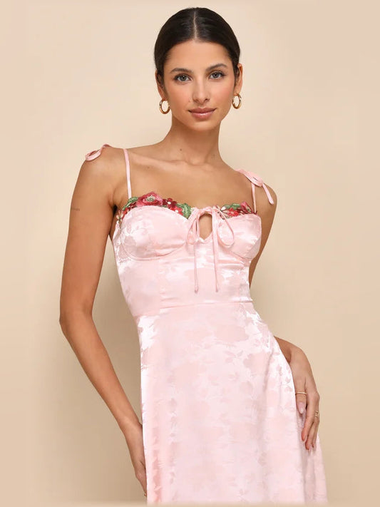 Light pink satin midi dress front view, embroidered floral bodice and ruched bust ribbon