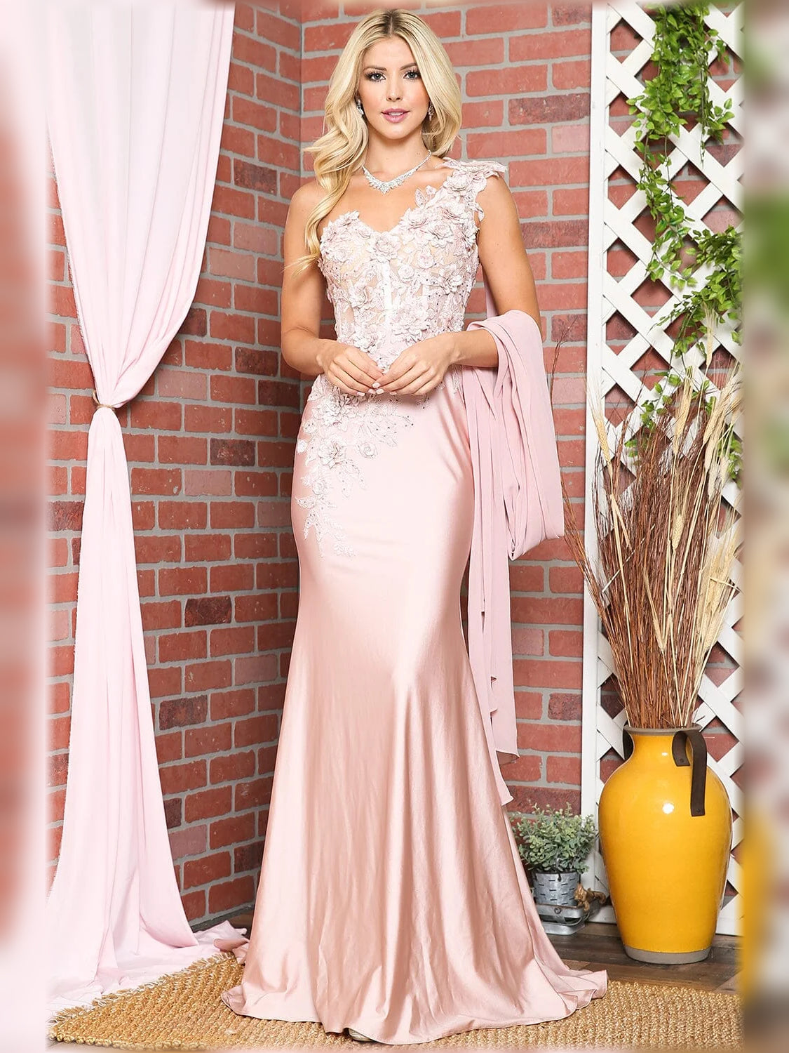 One-shoulder mermaid formal dress in blush pink with floral lace detail, floor-length.
