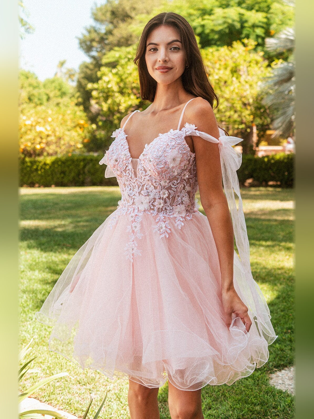 Blush pink tulle A-line homecoming dress with floral applique and bow sleeves