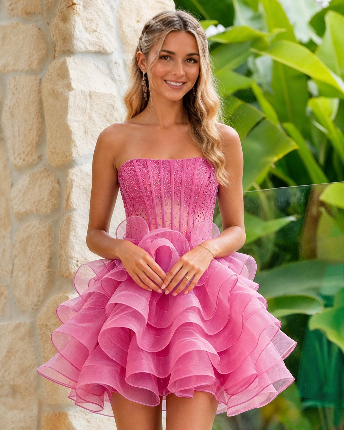 Strapless fuchsia glitter corset dress with layered organza ruffle skirt