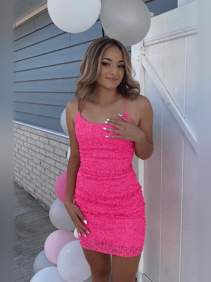 Hot pink sequin mini dress with spaghetti straps and bodycon fit