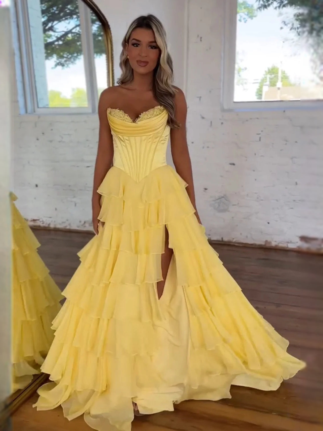 Yellow strapless corset prom dress with sweetheart neckline and tiered tulle skirt