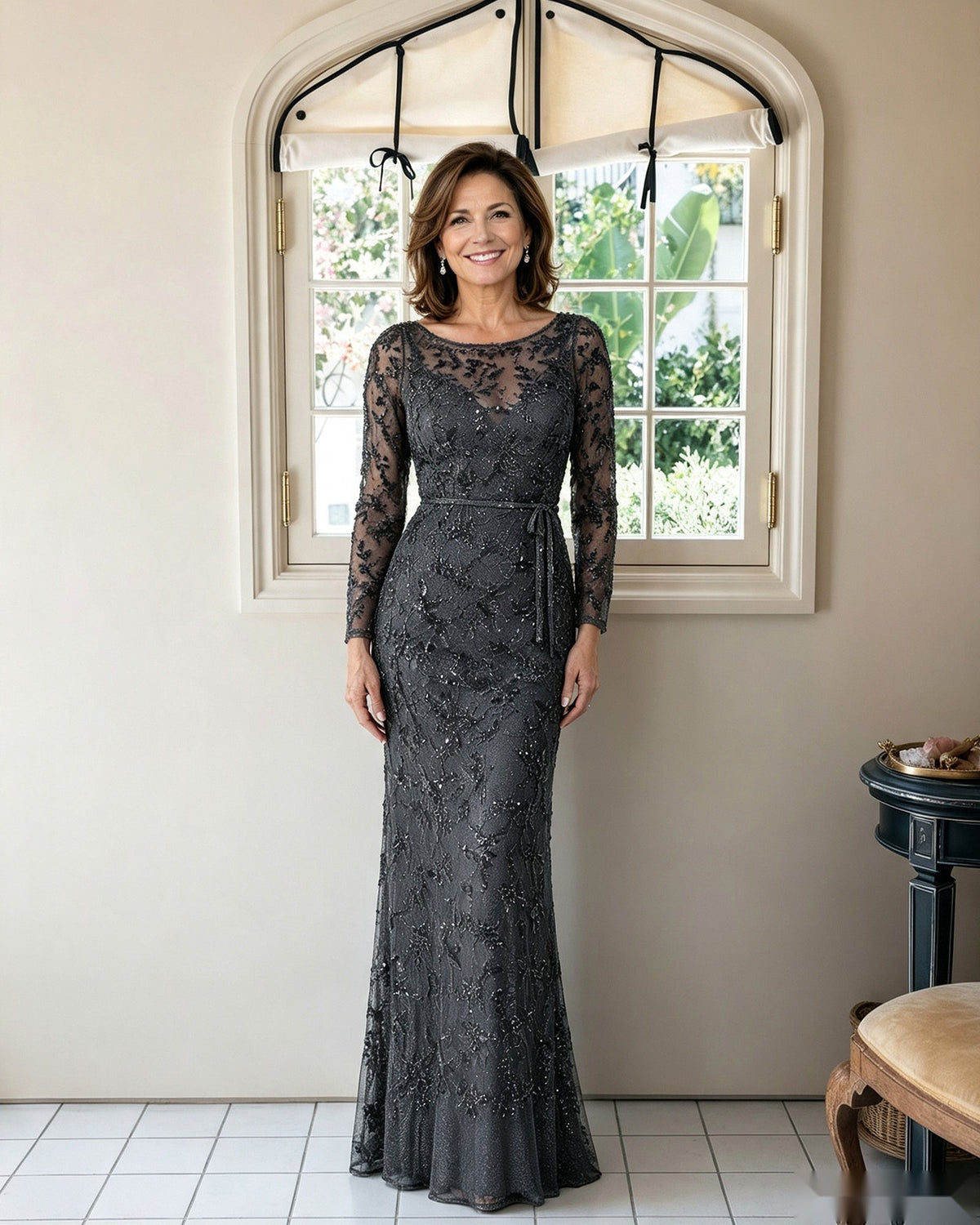 Illusion lace sheath dress in black with long sleeves and fitted floor-length silhouette