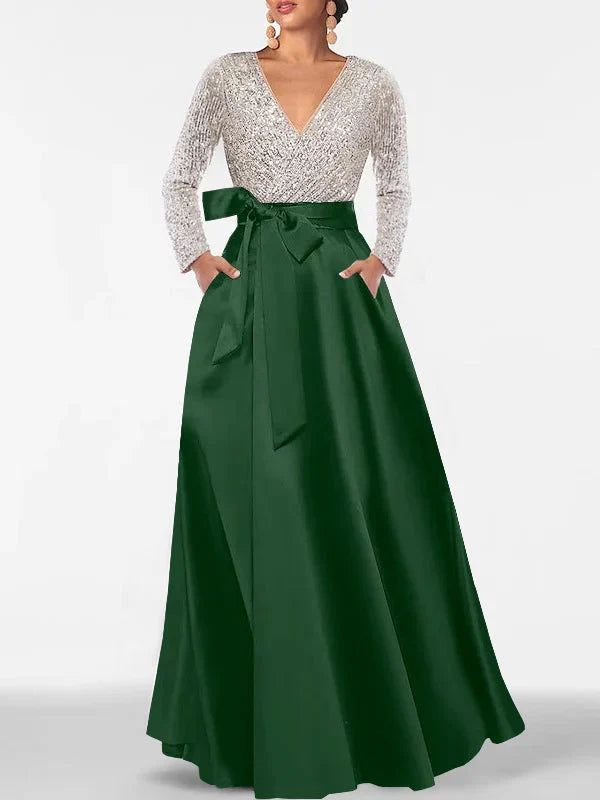 V-neck formal dress with silver sequin long sleeves and dark green satin maxi skirt